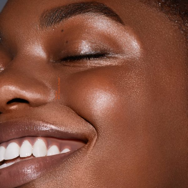 makeup to go blog tania d russell makeup educator Los Angeles San Francisco closeup of smiling black female model with glowy skin