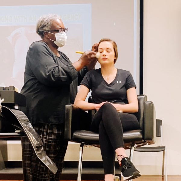 Makeup artist Tania D Russell teaching makeup for photography at Gould's Academy in Memphis, TN