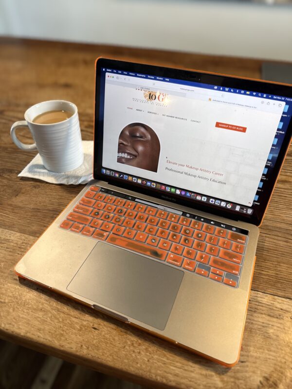 Tania Russell makeup artist career strategy session on laptop - Makeup to Go